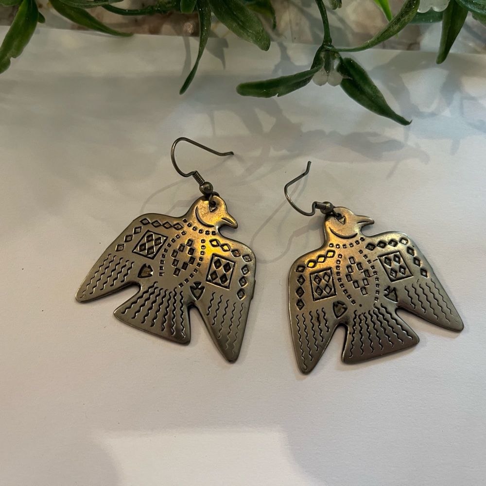 Silver toned (unknown metal) thunderbirds earring